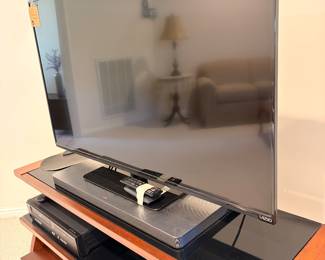TV, stand, soundbar, DVD VHS combo