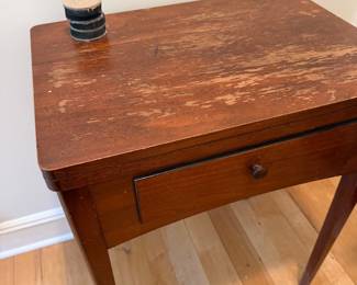 Empty vintage sewing machine cabinet table