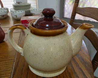 brown-and-cream speckled stoneware teapot