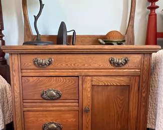 Tastefully appointed washstand, modern metal twig lamp