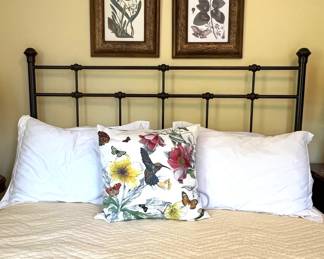 Bed with iron headboard