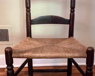 Ladder back chair, one of several
