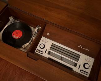 Vintage Fleetwood stereo console with built-in record player and radio