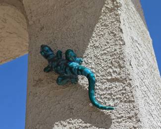 decorative, glossy turquoise and dark green ceramic lizard wall hanging