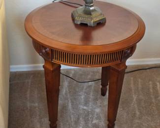 Round Traditional Accent / End Table – Warm wood finish with decorative fluted apron
