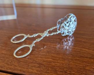 ornate, scissor-style serving utensil