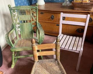 Collection of Three Vintage Children's Chairs: Wicker Rocker, Rush Seat Stool, and Slat-Back Chair