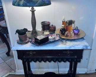 Antique side table with marble top and wheels