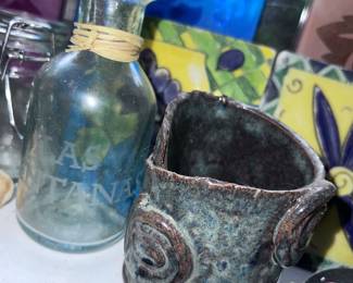 Lots of unique clay and glass jars