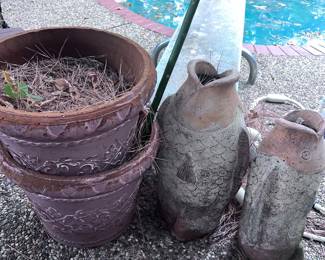 Terra-cotta pots with matching terra-cotta fish urns