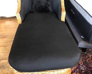 One of two Walters wicker chase lounges