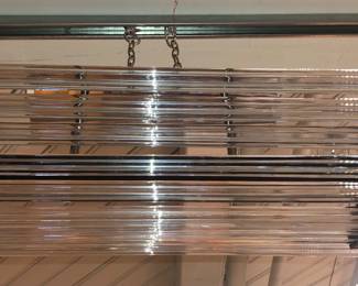 Another Post Modern glass rods chandelier this 1 in a black bracket probably Murano glass
