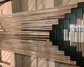 Another Post Modern glass rods chandelier this 1 in a black bracket probably Murano glass