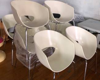 Set of eight chairs, some with nicks in their edges