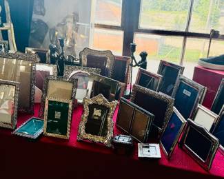 A large number of sterling silver picture frame by Christofle, Tiffany, Italian etc