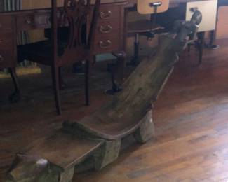 antique or vintage West African hand-carved wooden lounge chair or chaise, traditionally associated with the Lobi people of Burkina Faso