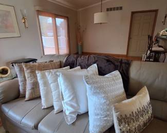 Dual Matching Leather Sofas and many decorative pillows