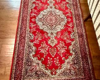 Rug behind camel back sofa - 6’ 6” x 3’