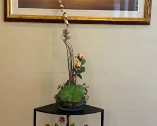 Black Metal Corner Accent Table With Floral Arrangement Large Seascape Print No Name