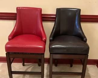 Pair Of Upholstered Counter HeiPair of upholstered counter height barstools in a red and black vinyl