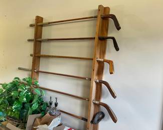 Antique Golf Clubs in Rack
