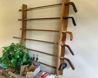 Antique Golf Clubs in Rack