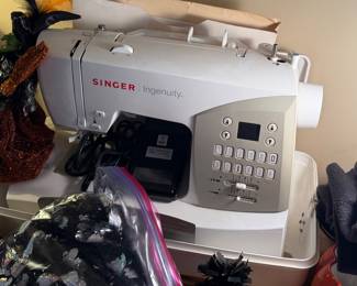 Singer Ingenuity 7436, a computerized electronic sewing machine equipped with 70 built-in stitches.