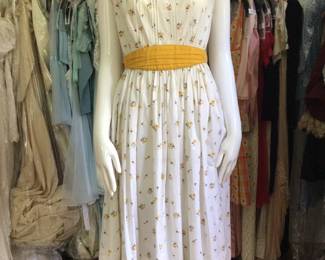 Darling and colorful 1960s floral day dress. Studio room.
