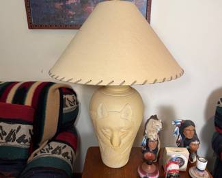 Pair of vintage Southwestern-style table lamp featuring a sculpted wolf face