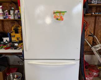 White Whirlpool bottom-freezer refrigerator model number GB2SHTXTQ01.