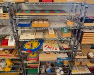 LE014 Wire shelving with mixed Montessori mathgeometry and classroom lesson materials