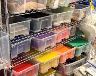 TS027 Clear bins of fabricfelt and colorcoded craft papersheets on wire shelving