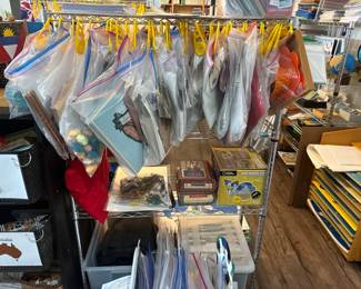 LE004 Rolling wire lesson rack with many individually bagged Montessori lessons archaeologyscience materials visible