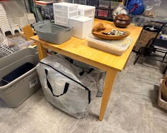 TS013 Wood worktable with gray tubs white drawer organizers and large zippered storage bag beneath