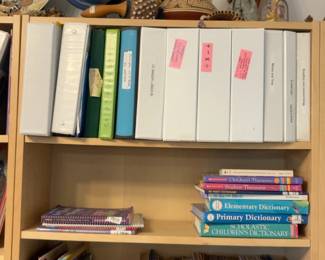 LE041 Bookcase with curriculum binders dictionariesreference books globe and cultural objects