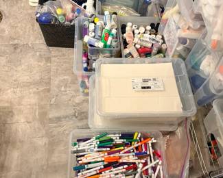 TS024 Floor bins of markerspaintcraft supplies with clear lidded storage boxes
