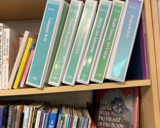 LE068 NAMC Lower Elementary curriculum binders on bookcase