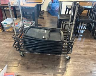 LE060 Stacked folding chairstable components on rolling wire cart