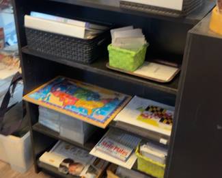 LE027 Black geography shelf with labeled continent baskets and maplesson materials