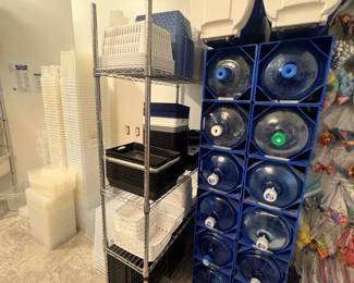 TS006 Rolling wire shelf with stacked classroom basketstrays beside water bottle rack
