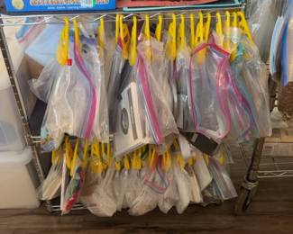 LE020 Alternate view of rolling lesson rack with individually bagged lessons