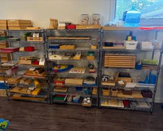 LE011 Large wire shelving units holding numerous Montessori materials and wooden lesson boxes