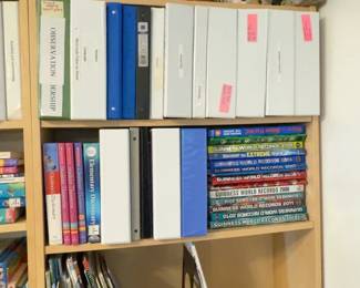 LE040 Bookcase with curriculum binders dictionaries Guinness World Records books and cultural figures