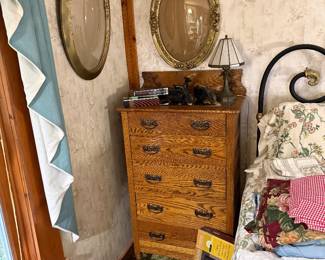 Bedroom 1: tall dresser, convex frames