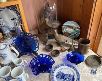 Living Room: Taxidermy Quail, souvenir plates, cobalt glassware 