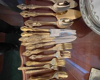 Ornate gold-toned flatware