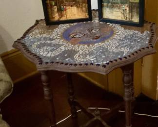 Antique octagon shaped table with mosaic tile sun figure, two impasto paintings of European street scenes signed