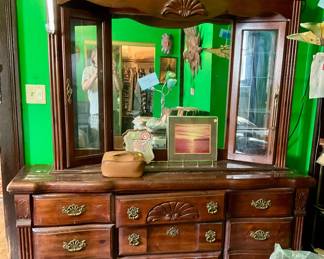 Large dresser with glass cabinets and lighr