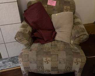 Overstuffed chair and blankets