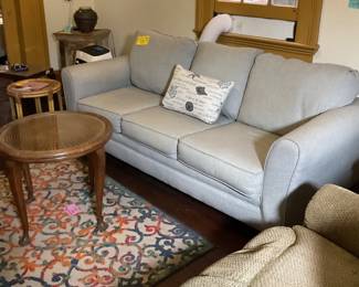 Antique French round table, sofa with queen size pull out bed